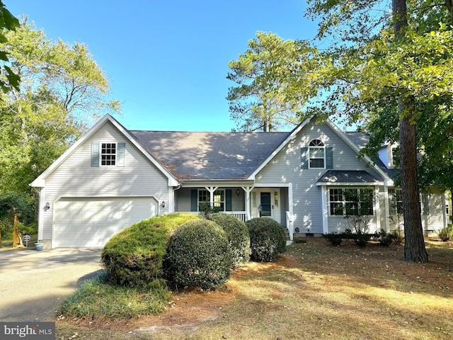 view of front of property with a garage and a porch