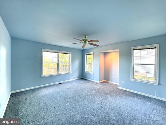 unfurnished room featuring carpet floors and ceiling fan