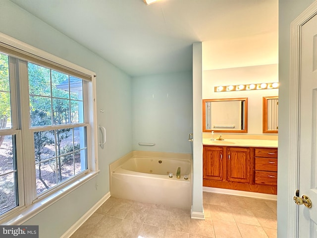 bathroom with vanity, a bathtub, and tile patterned flooring