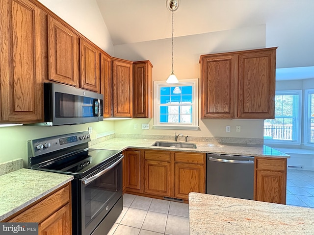 kitchen featuring sink, light tile patterned flooring, stainless steel appliances, vaulted ceiling, and pendant lighting