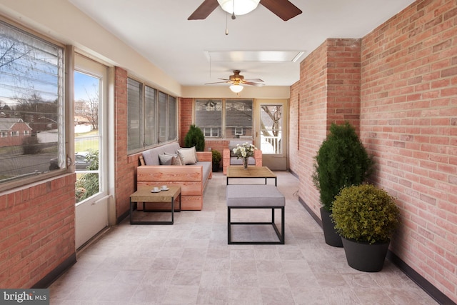 sunroom / solarium with ceiling fan and plenty of natural light