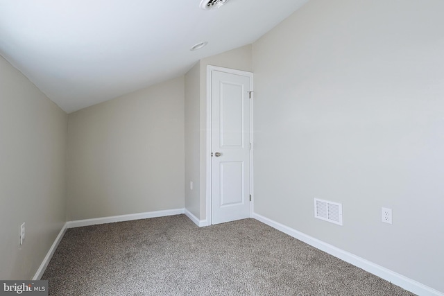 additional living space featuring carpet and vaulted ceiling