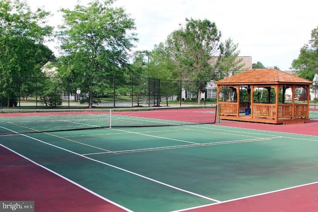 view of tennis court featuring a gazebo