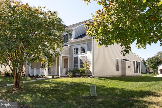 view of front of home with a porch and a front lawn