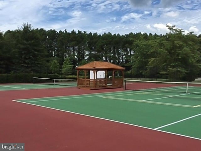 view of tennis court with a gazebo and basketball court