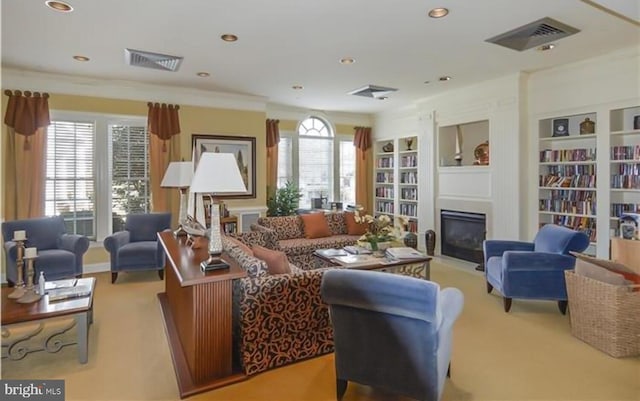 carpeted living room featuring built in features