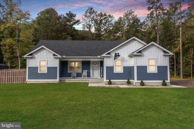 view of front of house featuring a porch and a yard