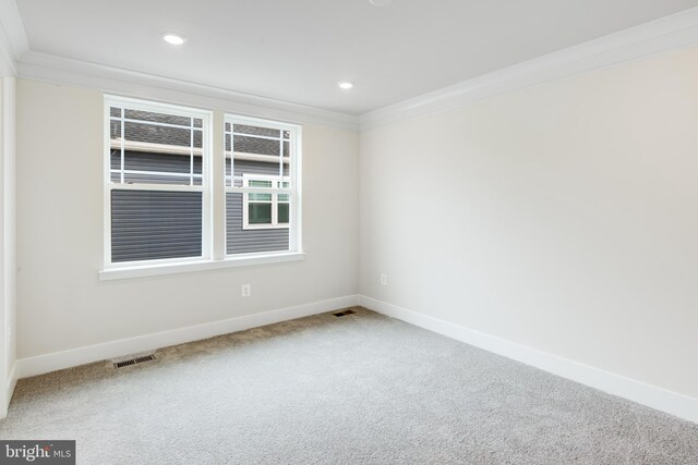 carpeted empty room with ornamental molding