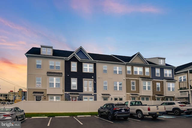 view of outdoor building at dusk