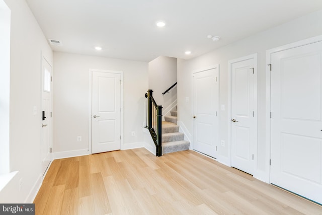 foyer with light hardwood / wood-style floors