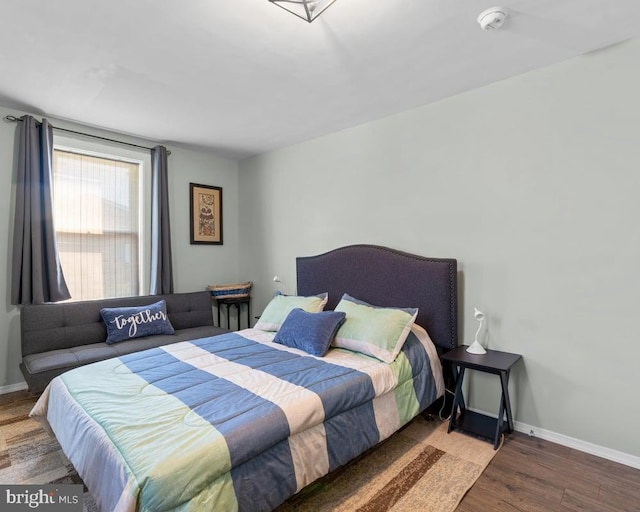 bedroom featuring dark wood-type flooring