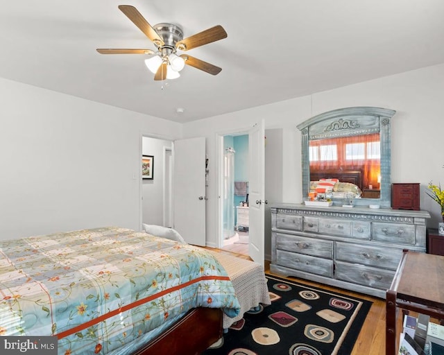 bedroom with ceiling fan and light hardwood / wood-style flooring