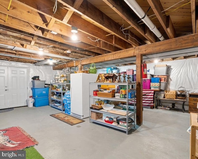 basement featuring white refrigerator