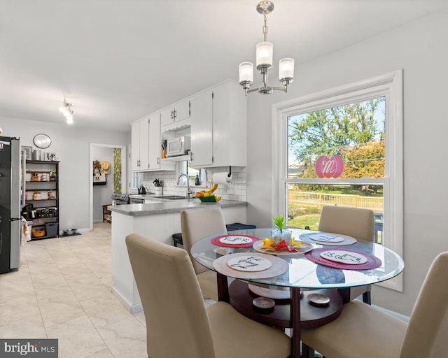 dining area featuring a chandelier