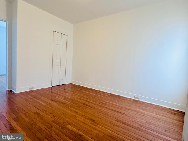 unfurnished bedroom featuring hardwood / wood-style flooring