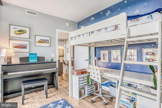 bedroom with hardwood / wood-style floors