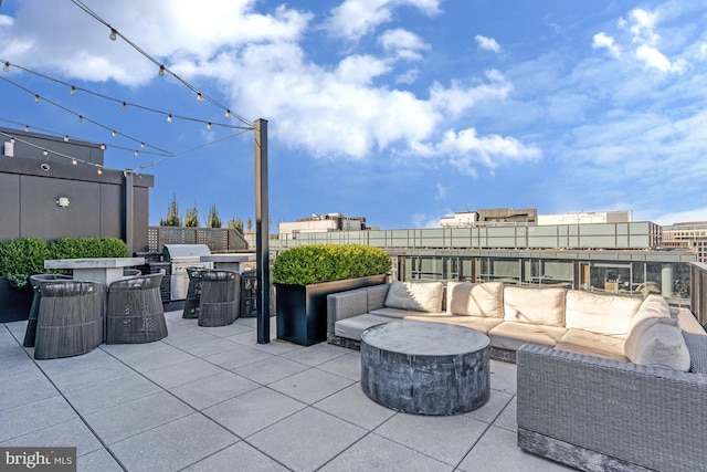 view of patio / terrace with grilling area, exterior kitchen, and an outdoor living space