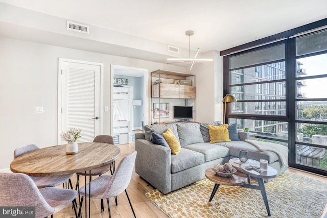 living room with light hardwood / wood-style floors