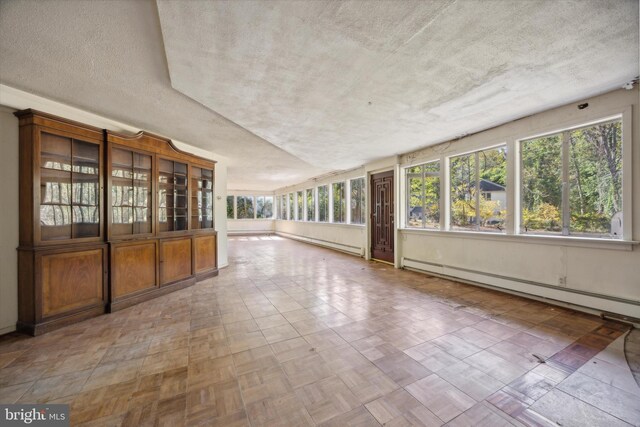 interior space featuring a textured ceiling and a baseboard radiator