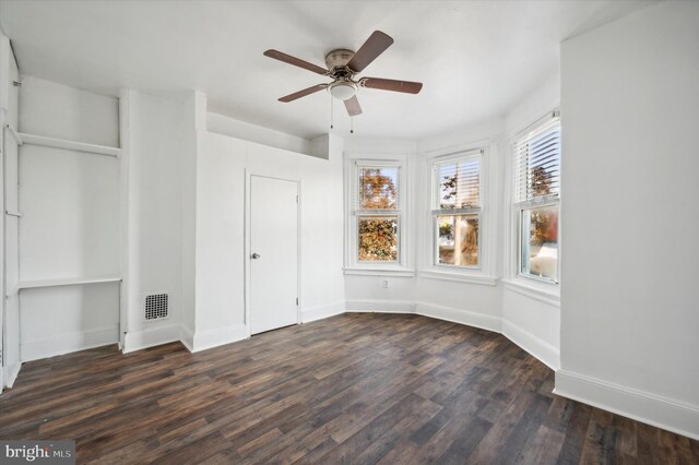 128 N Dewey St, Philadelphia, PA 19139 - unfurnished bedroom with ceiling fan, baseboards, dark wood finished floors, and visible vents