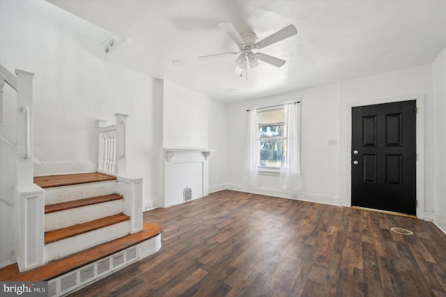 unfurnished living room with ceiling fan and dark hardwood / wood-style floors