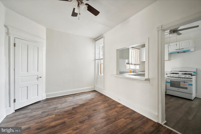 interior space featuring dark hardwood / wood-style floors and ceiling fan