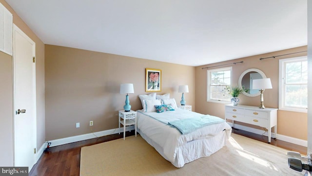 bedroom with hardwood / wood-style flooring