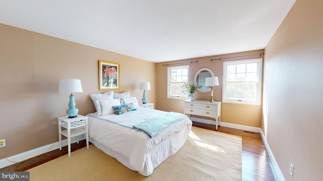 bedroom with hardwood / wood-style floors