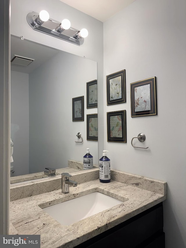 bathroom featuring vanity and visible vents