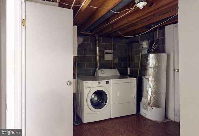 laundry area with gas water heater, dark parquet flooring, and independent washer and dryer