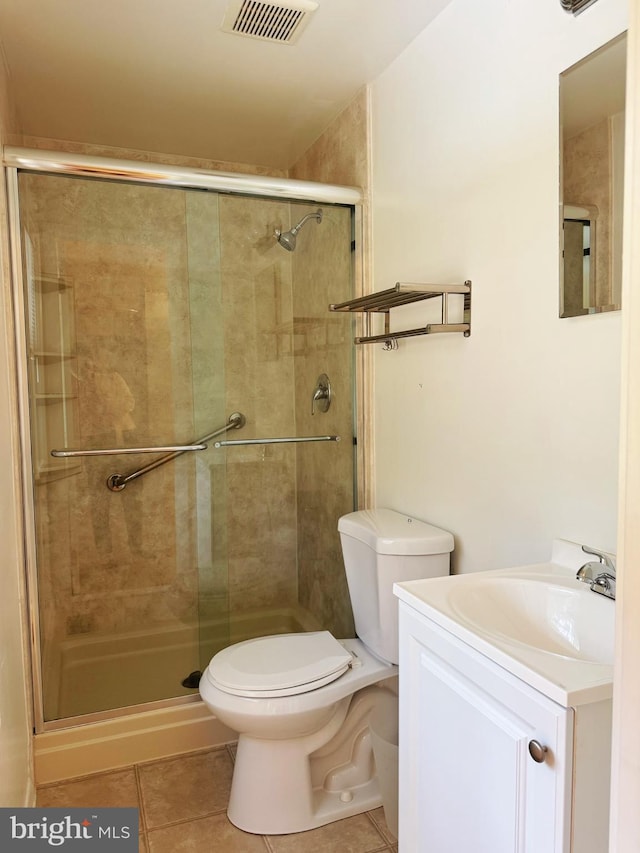 full bathroom featuring tile patterned flooring, visible vents, and a shower stall
