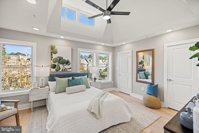 bedroom with light hardwood / wood-style floors and ceiling fan