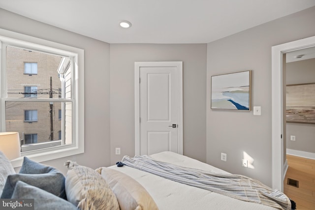 bedroom with wood-type flooring