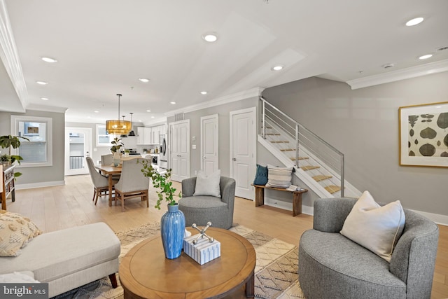 living room featuring crown molding and light wood-type flooring