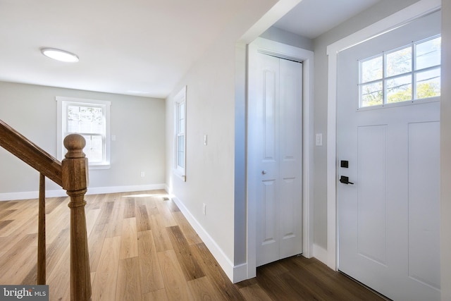 foyer featuring plenty of natural light and light hardwood / wood-style flooring