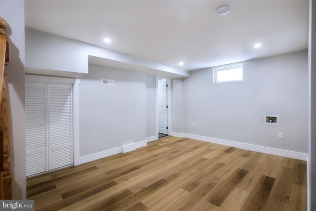 basement featuring wood-type flooring