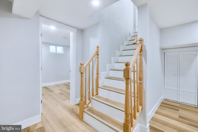 stairway featuring hardwood / wood-style floors