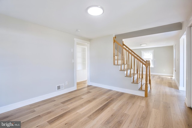 unfurnished room featuring light wood-type flooring