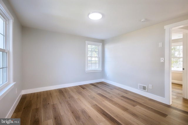 spare room featuring light wood-type flooring