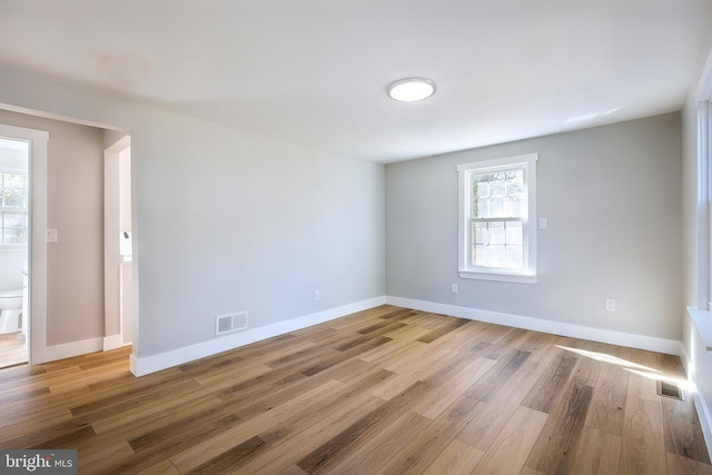 empty room with wood-type flooring