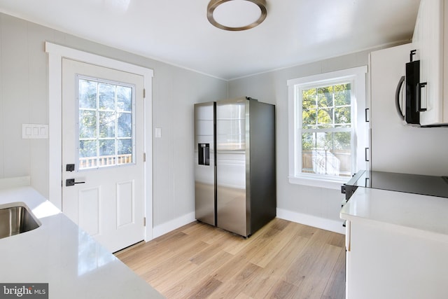 entryway with light wood-type flooring