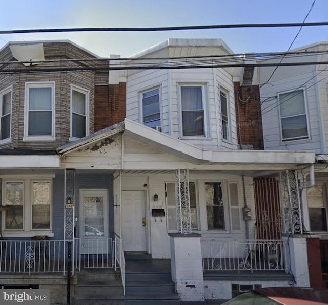 multi unit property featuring a porch