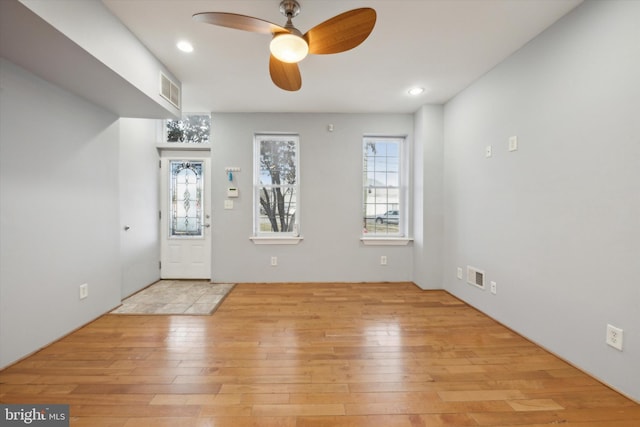 foyer featuring ceiling fan and light hardwood / wood-style floors