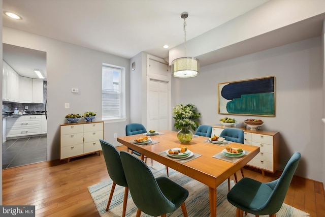 dining area with hardwood / wood-style floors