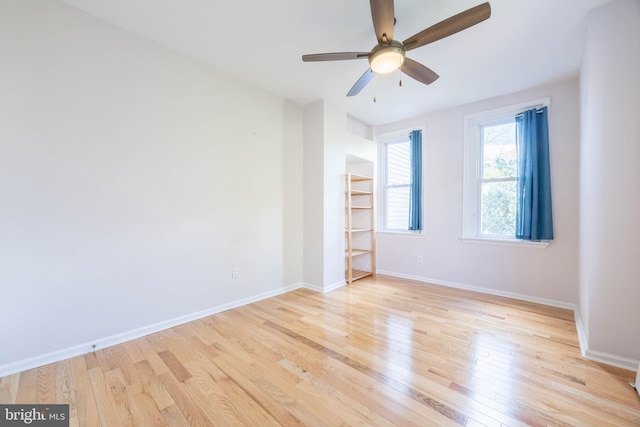 spare room with ceiling fan and light hardwood / wood-style floors