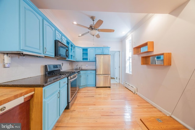 kitchen featuring blue cabinets, stainless steel appliances, light wood-type flooring, and baseboard heating