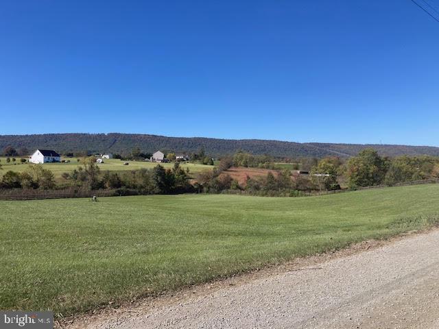 property view of mountains featuring a rural view