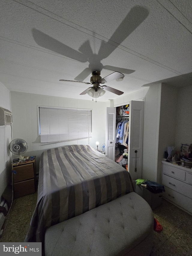 bedroom featuring ceiling fan and a closet