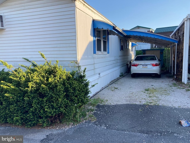 view of side of property with a carport