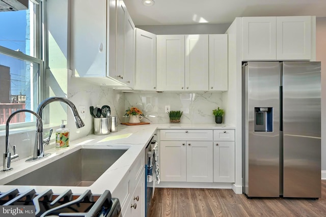 kitchen featuring sink, white cabinetry, and stainless steel appliances